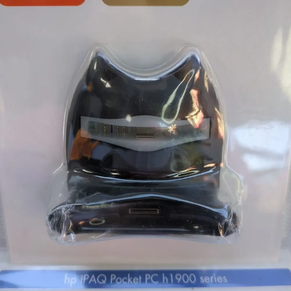 HP iPAQ Pocket PC h1900 series USB dock/charger.